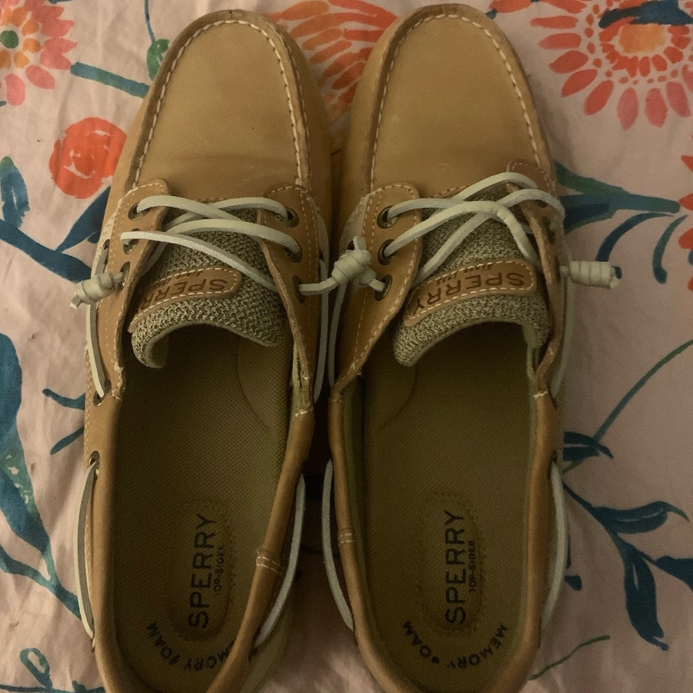 Tan slip on sperry shoes.